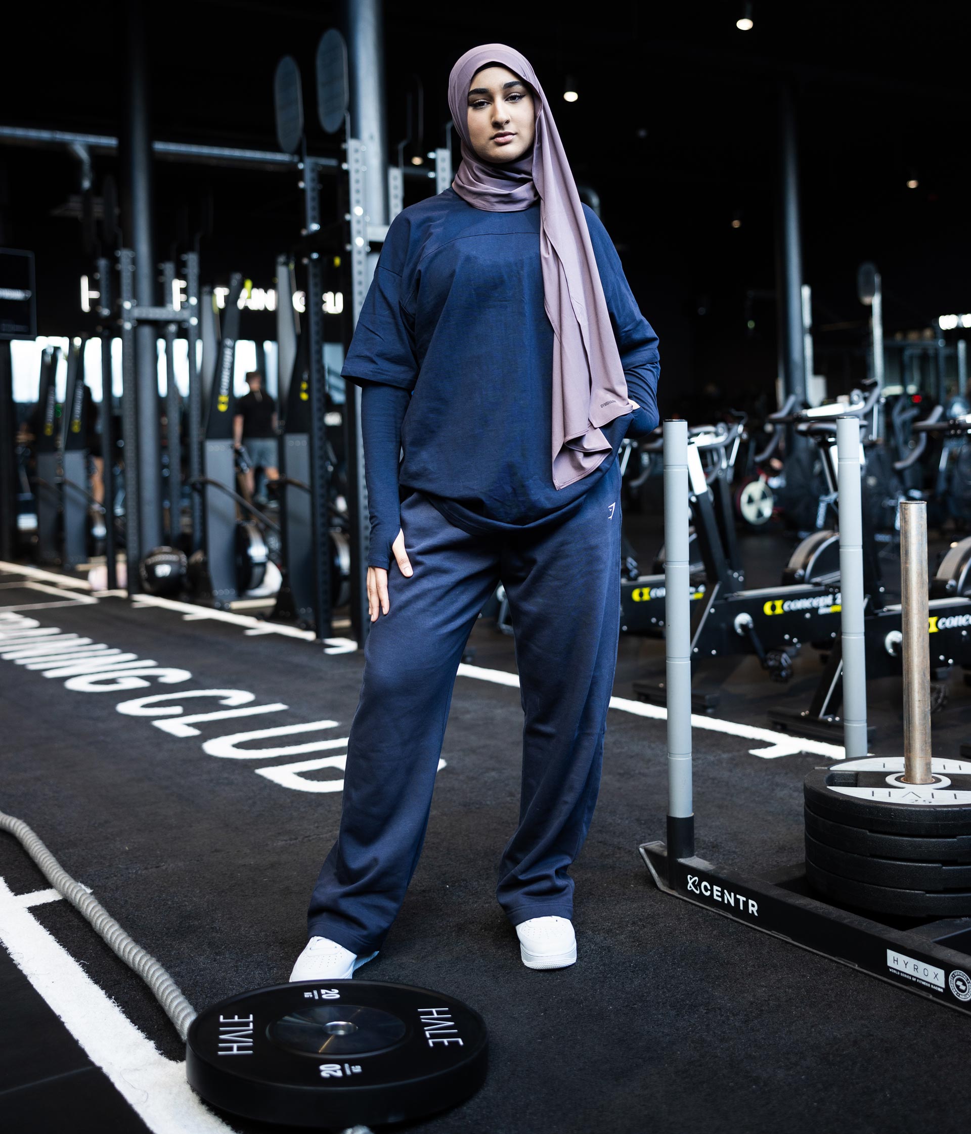 Coach posing for the picture in the gym